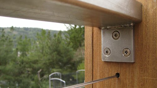 Stainless steel railing attached to ipe post